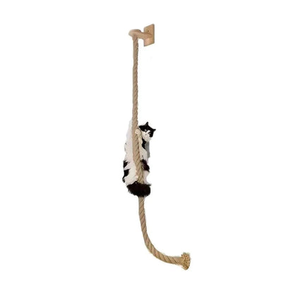 Cat ladder made of natural pine wood with thick twisted sisal rope mounted on white wall with a cat climbing it