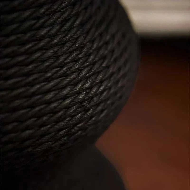 Close-up of black woven paper rattan texture on adjustable Cat Scratching Post with twisted rope pattern