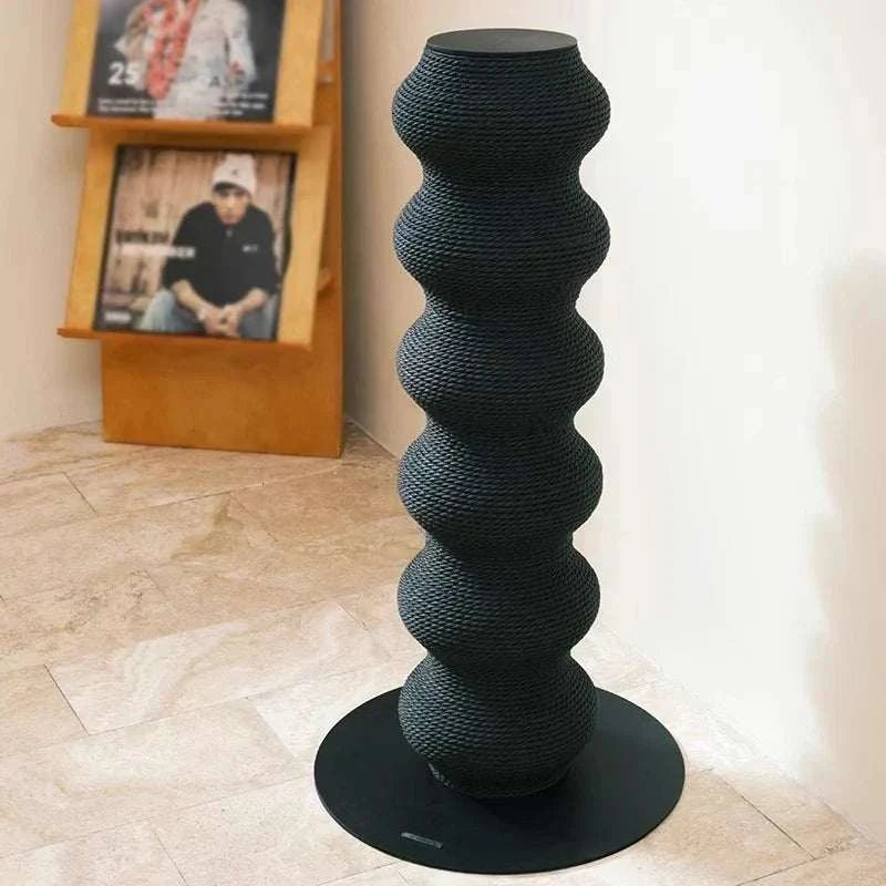Cat Scratching Post in black textured vertical design with wave-like curves on a round base, modern and stylish