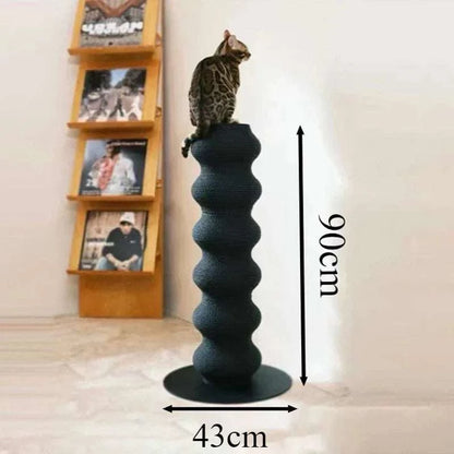 Cat Scratching Post in black with a textured wavy column design and circular base, topped with a cat sitting